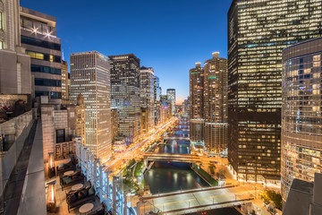 Wall Mural - Beautiful aerial view of Chicago skylines at blue hour, modern riverside illuminated skyscrapers