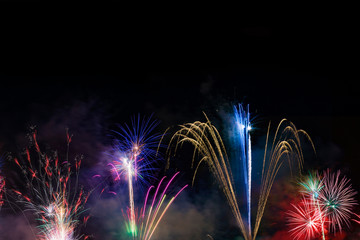 Fireworks display over dark sky