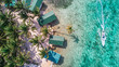 Aerial drone view of Tobacco Caye small Caribbean island with palm trees and bungalows in the Belize Barrier Reef
