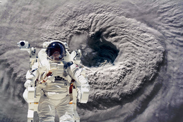 Wall Mural - astrounaut spacewalk in the space on earth orbit at night. elements of this image furnished by nasa 