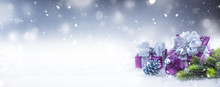 Christmas Luxury Purple Gifts In Snow And Abstract Snowy Atmosphere
