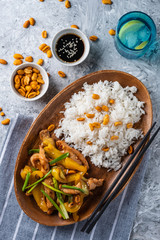 Wall Mural - Kung Pao chicken, stir-fried Chinese sichuan traditional sichuan  dish with chicken, peanuts, vegetables and chili peppers.