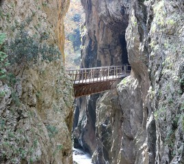 Abandoned old rusty rack railway bridge of odontotos train connecting two cliffs at vouraikos gorge  over a river at Kalavryta in Achaia Greece