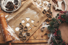 Making Christmas Gingerbread Cookies Flat Lay. Dough With Metal Cutters On Rustic Table With Wooden Rolling Pin, Cinnamon ,anise, Cones, Christmas Decorations. Atmospheric Stylish Image