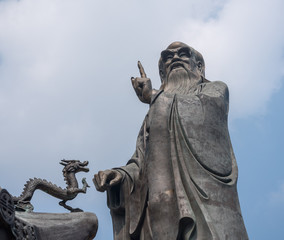 Small dragon by statue of Lao Tze by Temple of Tai Qing Gong at Laoshan near Qingdao China