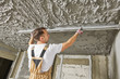 © Kadmy - Plasterer smoothing plaster mortar on ceiling with screeder