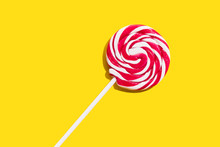 Red Lollypop On Yellow Background