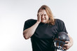 © alfa27 - Young handsome rugby player with long hair over isolated background holding helmet under his arm, feeling stressed and shocked with dissappointment that his team lost the game