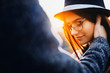 © Strelciuc - Hand of anonymous man touching face of beautiful young woman in stylish glasses and hat.Crop hand touching face of woman
