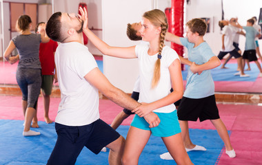 Kids exercising self-defense movements