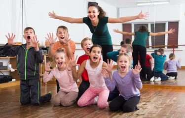  Happy children  in dance studio having fun