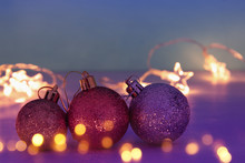 Image Of Christmas Festive Tree Gold, Purple And Violet Balls Decoration.