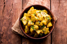 Jeera Aloo Is A Indian Main Course Dish Which Goes Well With Hot Puris, Chapatti, Roti Or Dal. Served In A Bowl Over Moody Background. Selective Focus