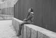© SB Arts Media - Depressed young woman sitting on urban city street overwhelmed a
