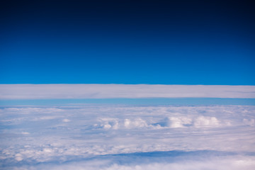 Poster - Flying above the clouds. view from the airplane