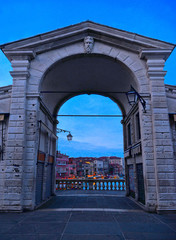 Wall Mural - Venice Italy, View from the portico arch of Rialto Bridge on canal grande and Venice cityscape, taken at dawn sunrise.