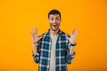 Smiling young man wearing plaid shirt