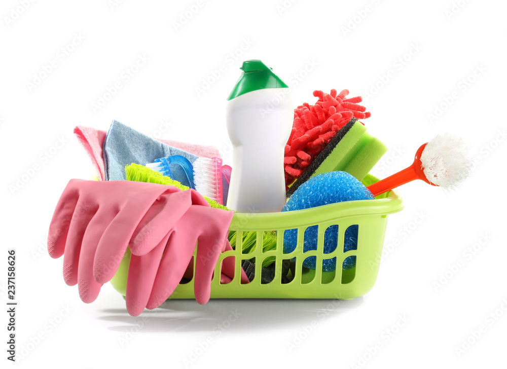 Basket with cleaning supplies on white background