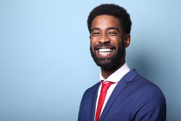 Wall Mural - Beautiful black man in front of a colored background