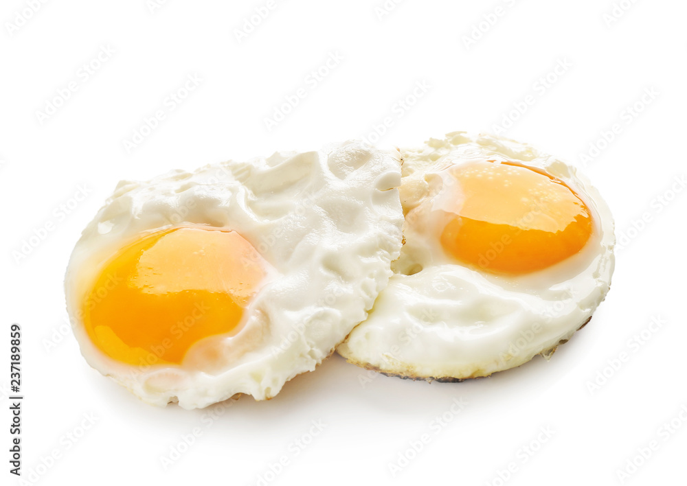 Fried tasty eggs with liquid yolk on white background