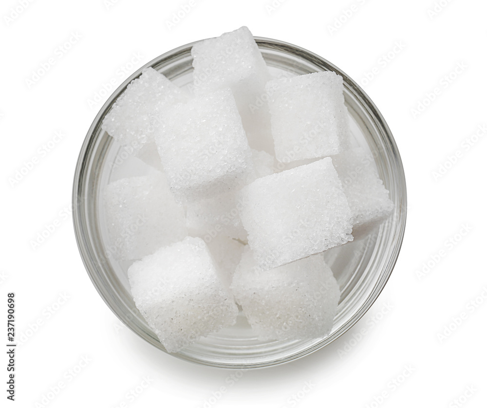 Bowl with refined sugar cubes on white background