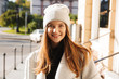 © Drobot Dean - Cheerful young woman dressed in autumn coat