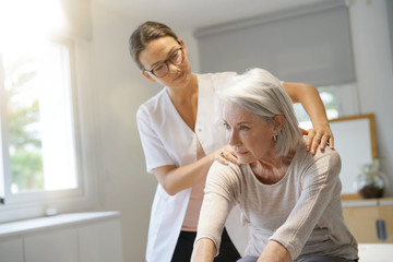 Wall Mural - Senior woman with her physiotherapist