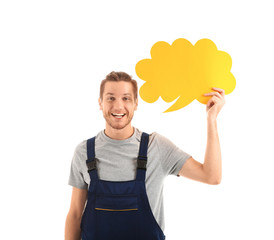 Young man holding blank speech bubble on white background