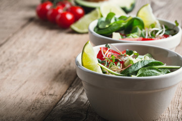 Wall Mural - Fresh vegetables salad with avocado and quinoa