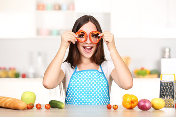 Beautiful woman cooking food in the kitchen