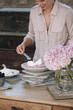 © Alberto Bogo/Stocksy - Person spreading cream on cake