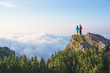 © RG&B Images/Stocksy - Hikers standing on top of the mountain on a sunny day