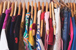 © Natalie JEFFCOTT/Stocksy - Close up of vintage clothing on a store rack