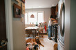 © Rob and Julia Campbell/Stocksy - Mom cooking dinner with daughter and dog