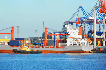 Tugboat assisting bulk cargo ship