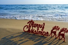 Happy New Year Concept, Merry Christmas Put On Sand Beach In Sunrise. 