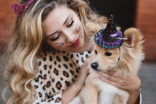 A Teenage Girl And Her Dog Dressed Up For Halloween