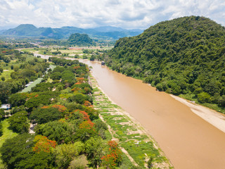 Wall Mural - The beautiful landscape of the countryside of Chiang Rai province with Mae Kok river. High angle view from drone.