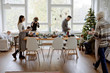 © Clique Images/Stocksy - Christmas dinner together