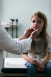 © Sean Locke Photography/Stocksy - Exam: Doctor Checks Glands Of Young Patient