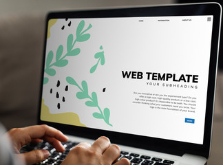Wall Mural - working on a web template on the laptop