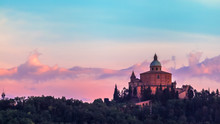 San Luca Basilica Church On Bologna Hill, In A Colorful Twilight. Pink And Blue. In Italy