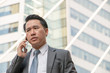 © thaninee - businessman talking on mobile phone