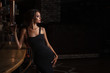 © Restyler - Stylish sexy woman standing near bar counter