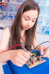 Poster - Girl engineer working on robotics project