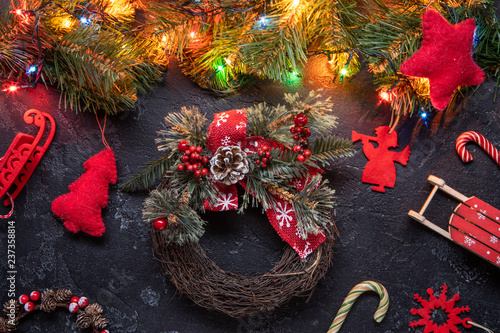 Fotografie, Obraz Christmas background with wreath. Top view.