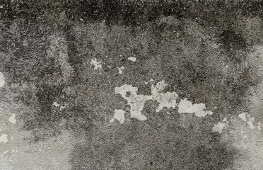 Gray grunge cracked wall with dark pattern and light spot background texture contrast