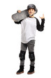Young boy posing with a skateboard and gesturing rock and roll