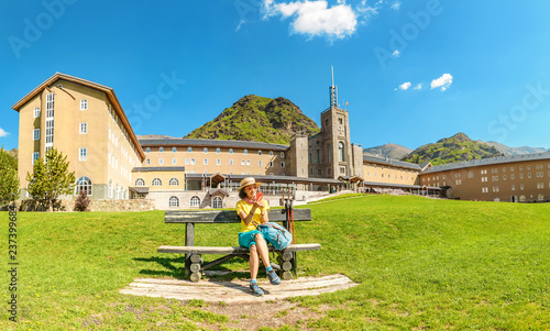 Cuadros en Lienzo Traveler tourist woman in Vall de Nuria Sanctuary hotel and church building in the catalan pyrenees mountains, Spain