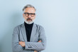 © contrastwerkstatt - Serious man with folded arms staring at the camera